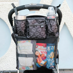 J.L. Childress Cups 'N Cargo, Universal Fit Stroller Organizer with Extra Large Storage, Expandable Deep Cup Holders, Multiple Zippered Pockets, Unique Large Mesh Bag for Larger Items ( Mickey Black , One Size ) Mickey Black One Size U7