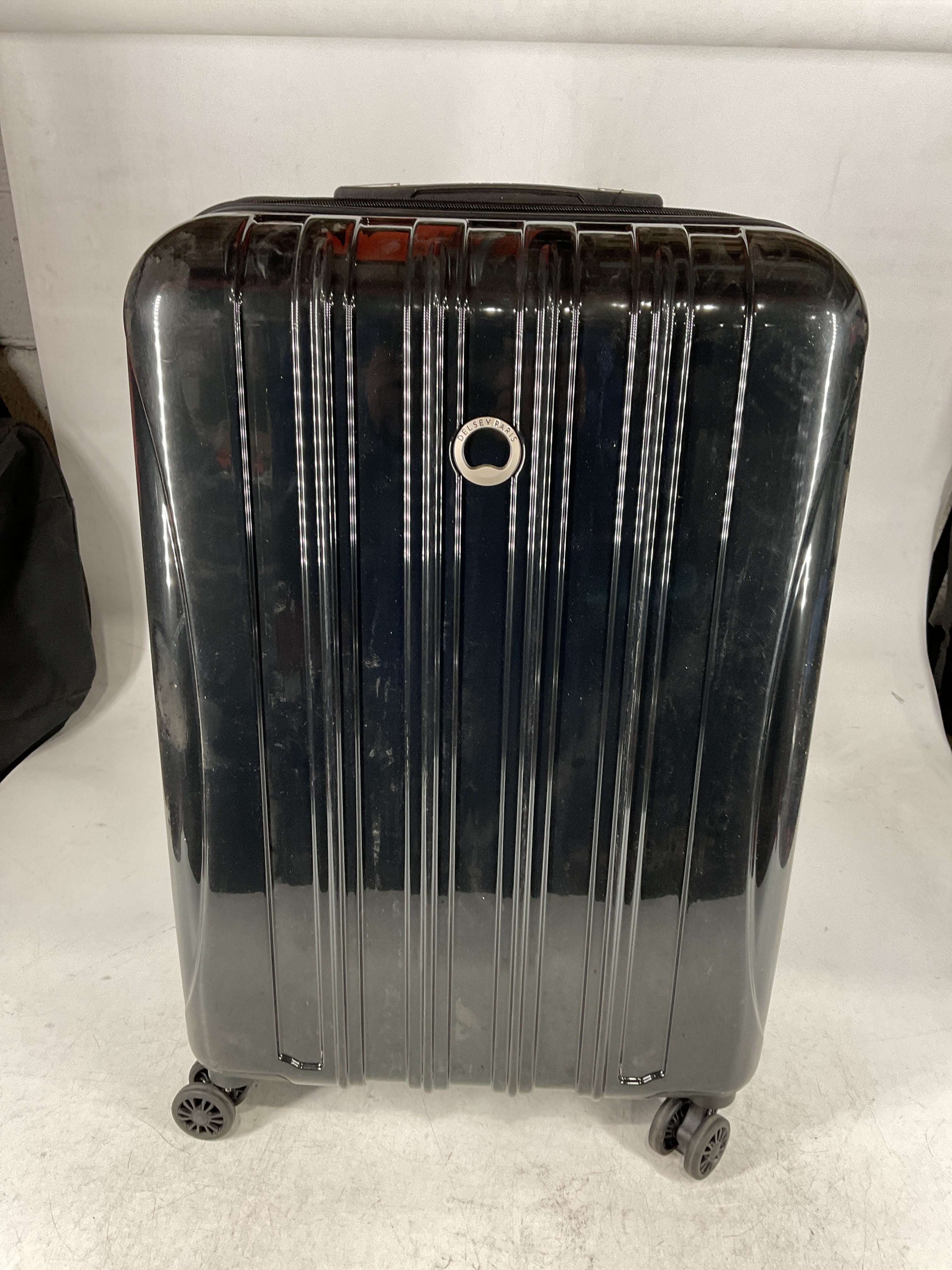 DELSEY Paris Helium Aero Hardside Expandable Luggage with Spinner Wheels Black Checked Medium 25 Inch U18