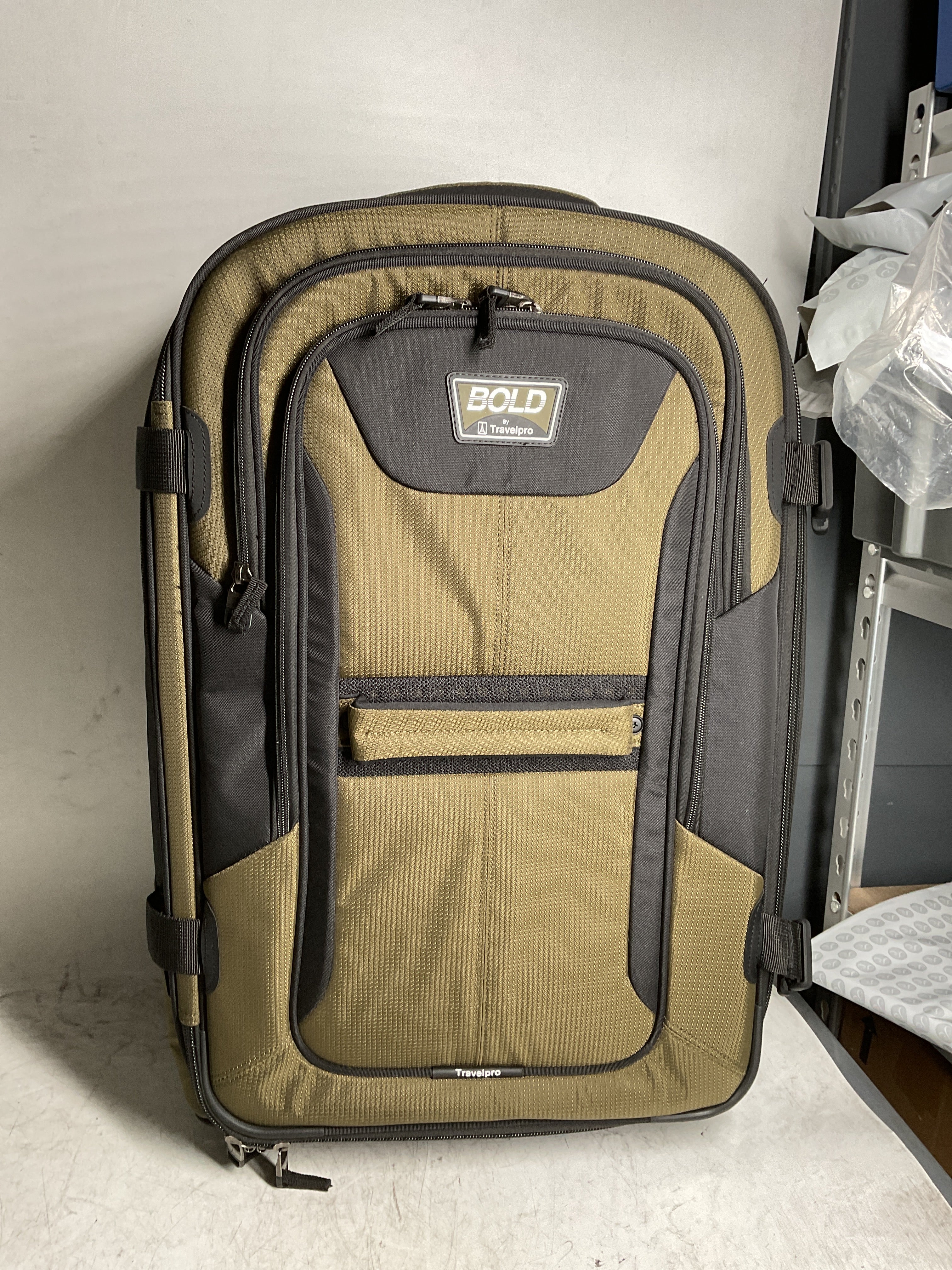 Travelpro Unisex-Adult Bold Softside Expandable Rollaboard Upright Luggage ( Olive/Black , Checked-Medium 25-Inch ) Olive/Black Checked Medium 25 Inch U2