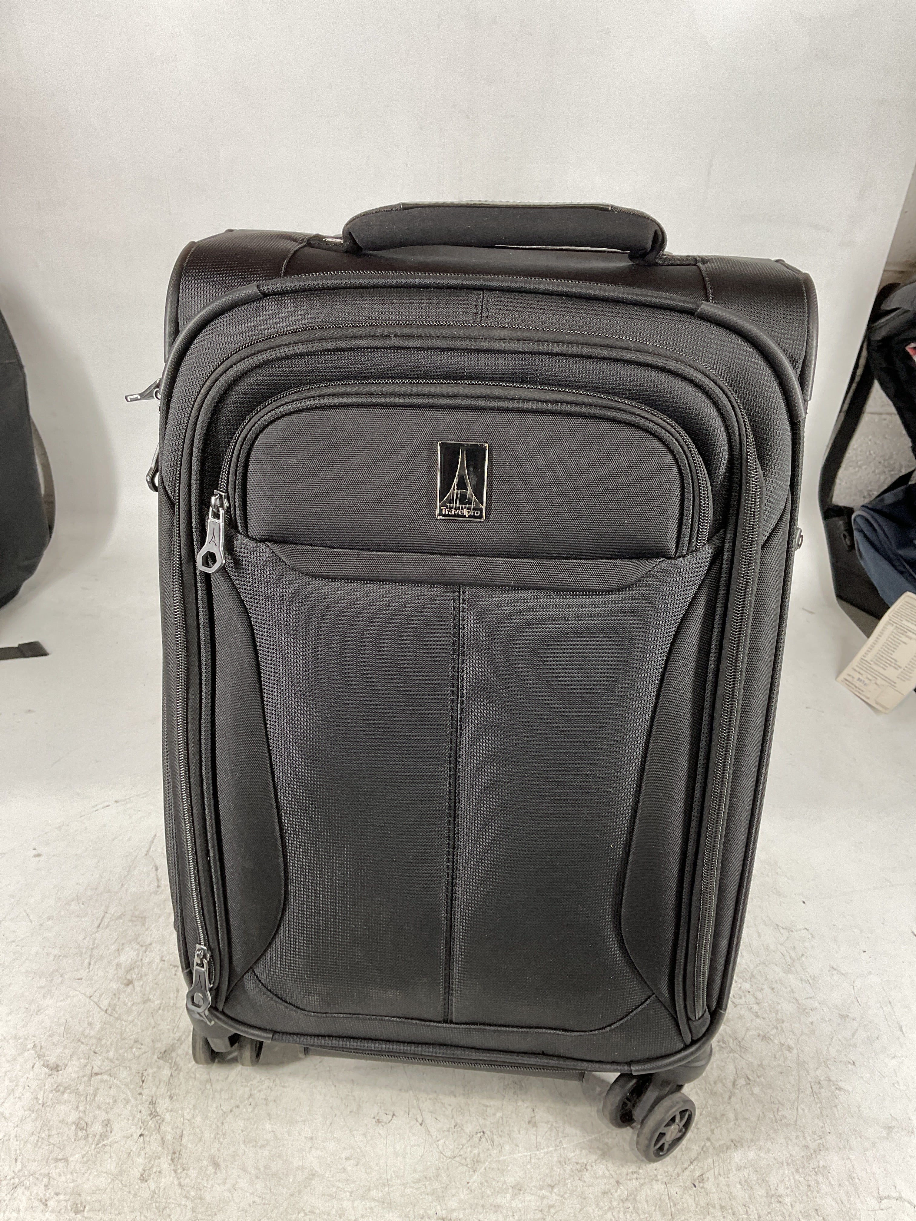 Travelpro Tourlite Softside Expandable Luggage with 4 Spinner Wheels, Lightweight Suitcase, Men and Women Black Carry On 21 Inch U15