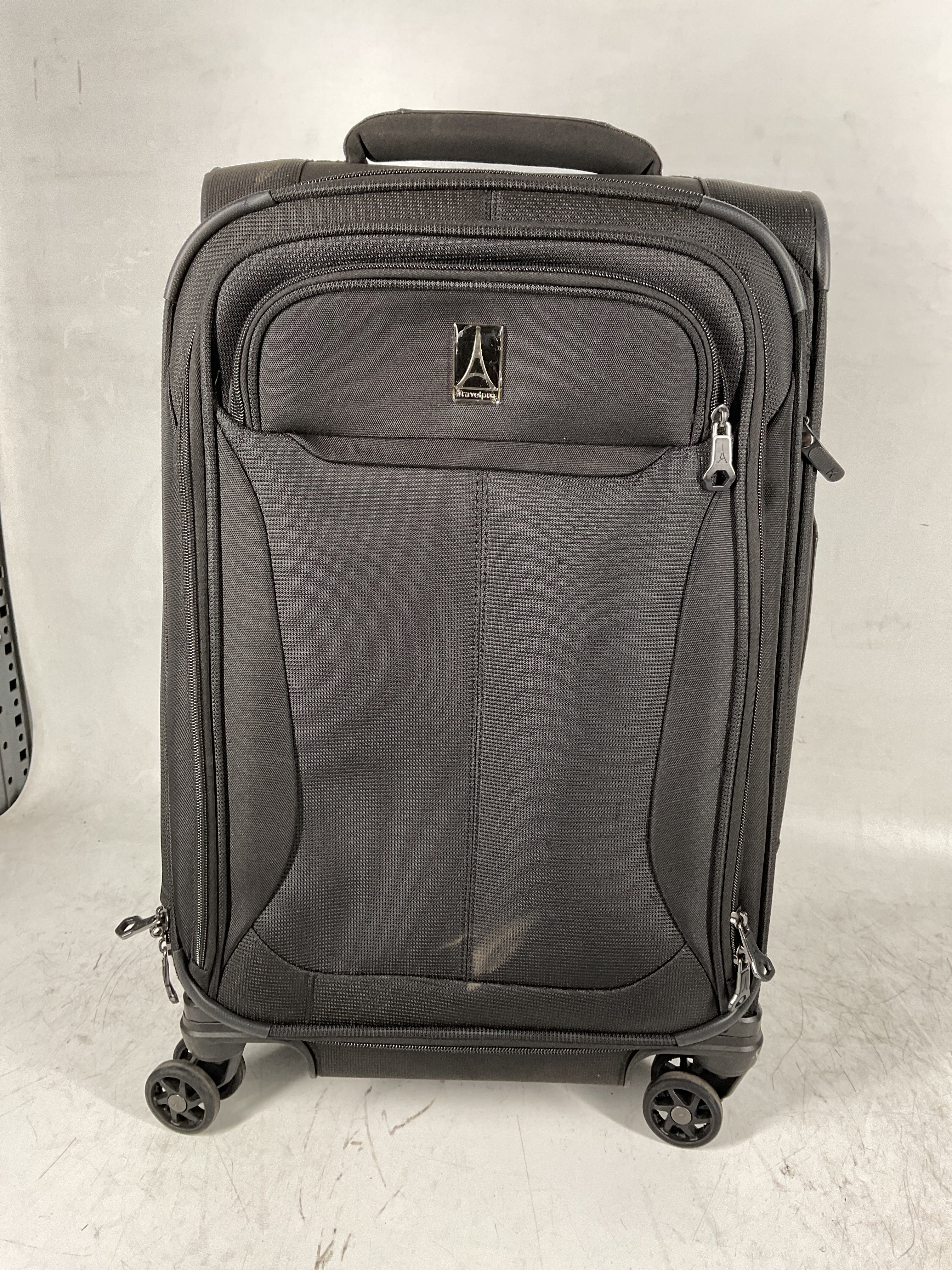 Travelpro Tourlite Softside Expandable Luggage with 4 Spinner Wheels, Lightweight Suitcase, Men and Women Black Carry On 21 Inch U30