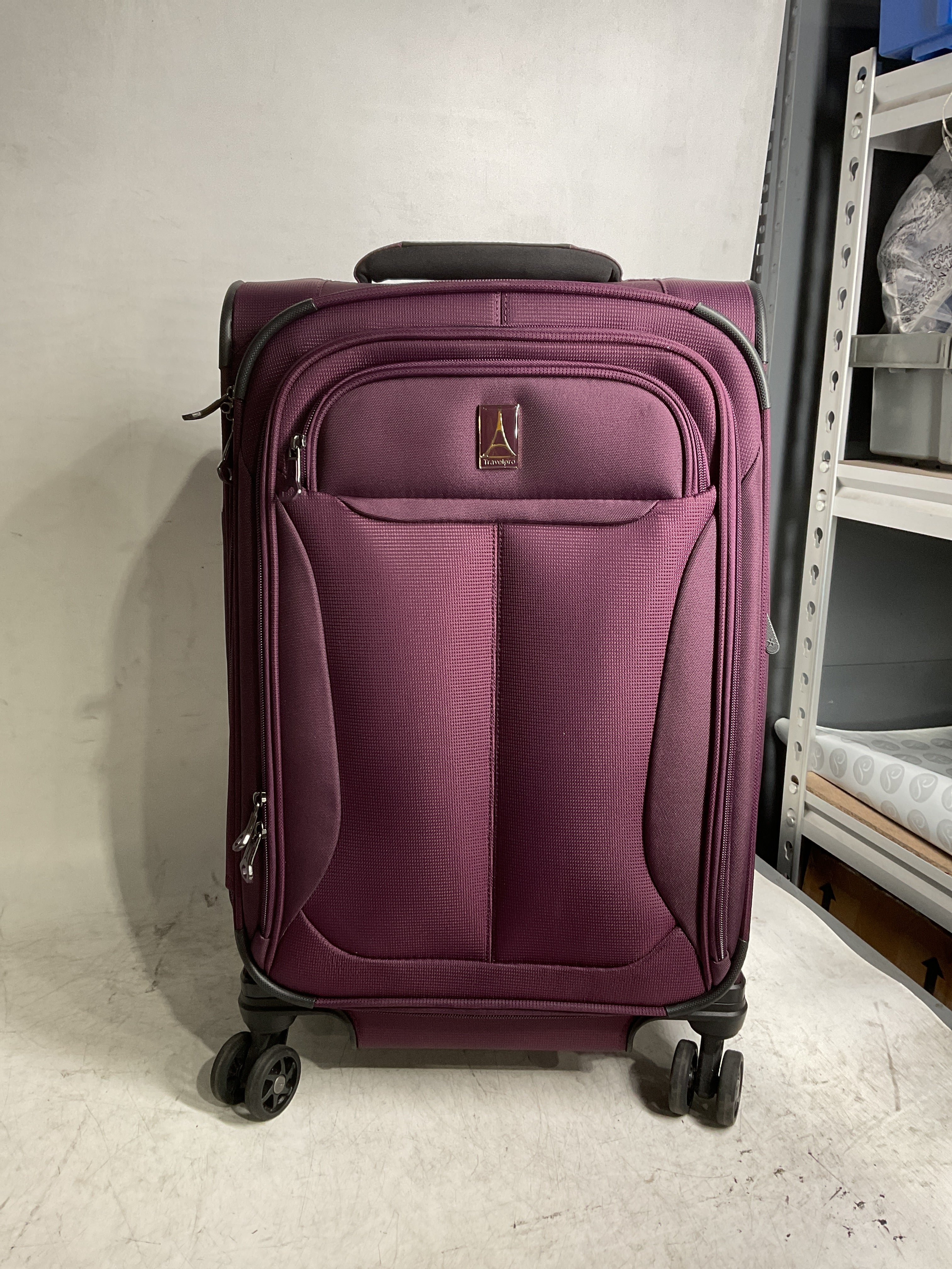 Travelpro Tourlite Softside Expandable Luggage with 4 Spinner Wheels, Lightweight Suitcase, Men and Women ( Deep Purple , Carry-On 21-Inch ) Deep Purple Carry On 21 Inch U9