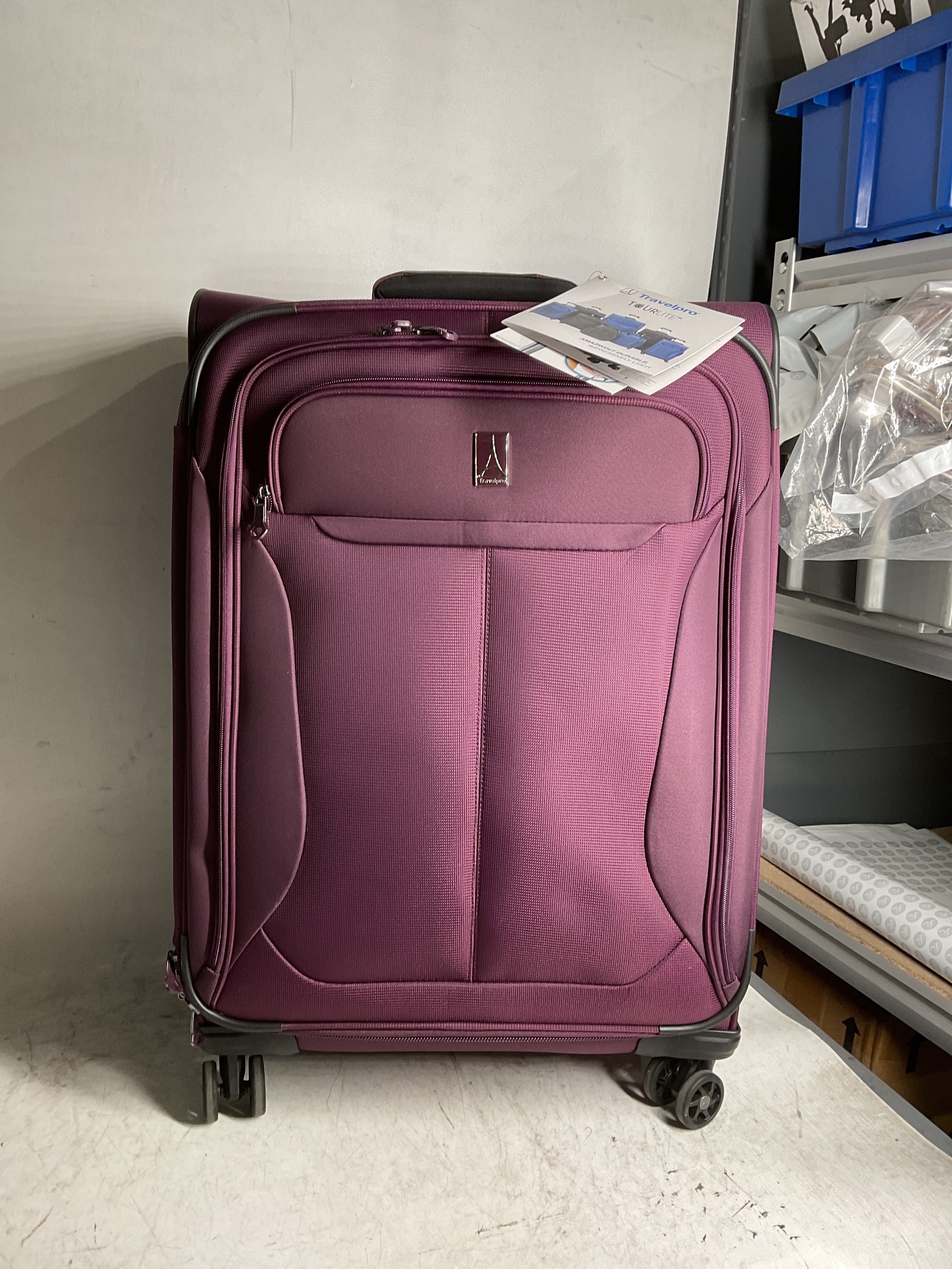 Travelpro Tourlite Softside Expandable Luggage with 4 Spinner Wheels, Lightweight Suitcase, Men and Women ( Deep Purple , Checked-Medium 25-Inch ) Deep Purple Checked Medium 25 Inch U1