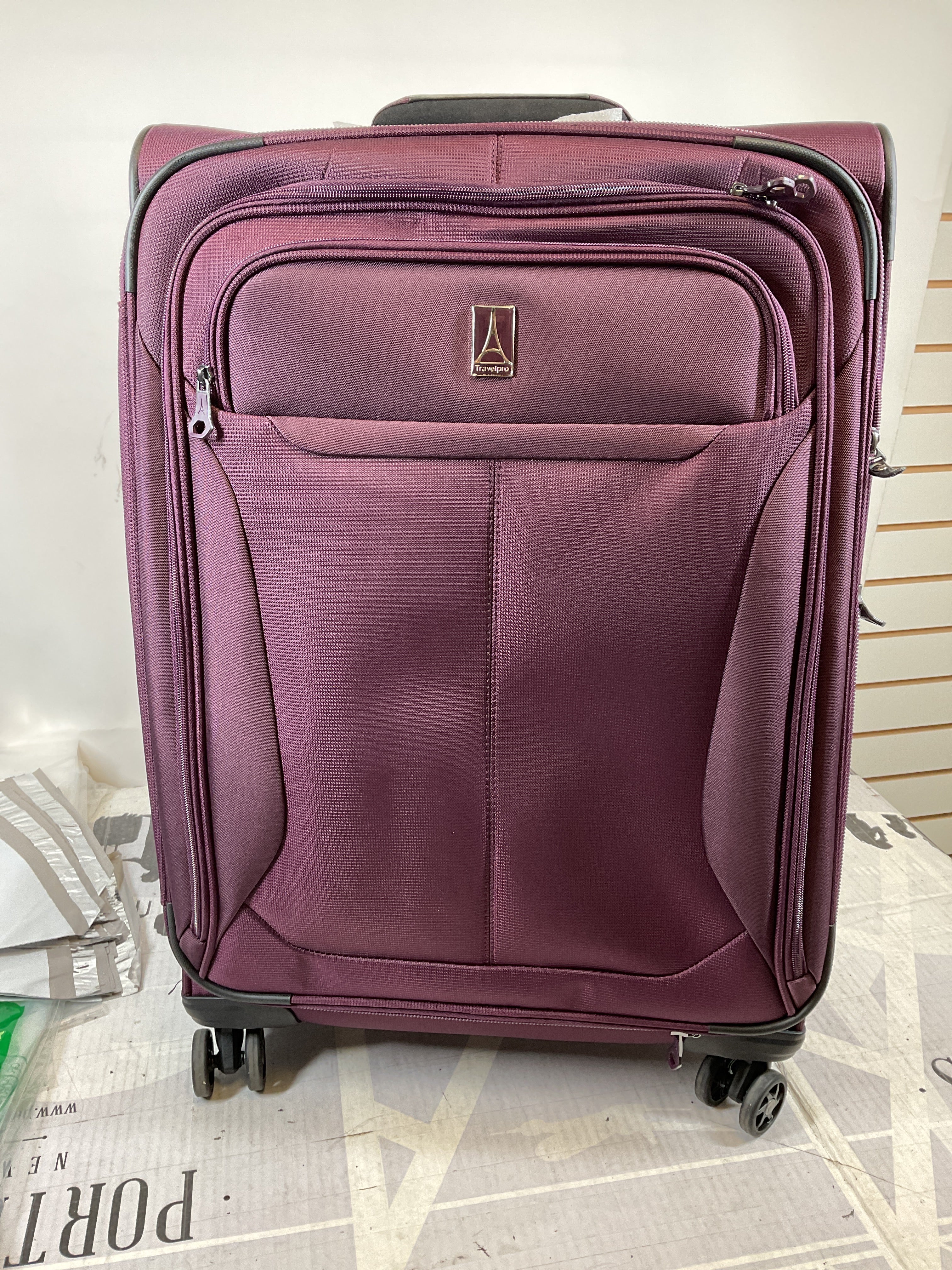 Travelpro Tourlite Softside 25" Expandable Luggage with 4 Spinner Wheels, Lightweight Suitcase, Checked Medium ( Deep Purple , Checked-Medium 25-Inch ) Deep Purple Checked Medium 25 Inch U11