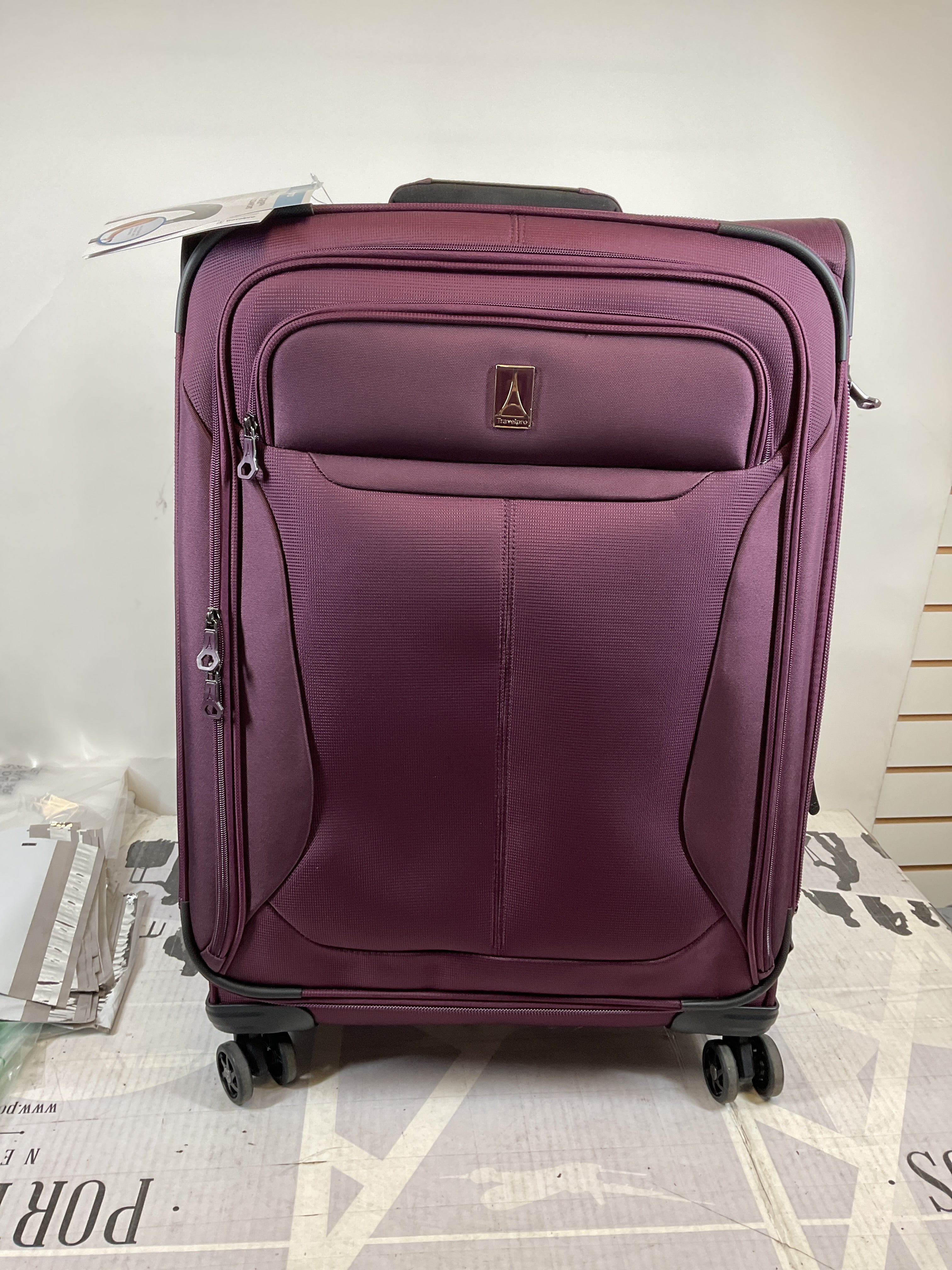 Travelpro Tourlite Softside 25" Expandable Luggage with 4 Spinner Wheels, Lightweight Suitcase, Checked Medium ( Deep Purple , Checked-Medium 25-Inch ) Deep Purple Checked Medium 25 Inch U12