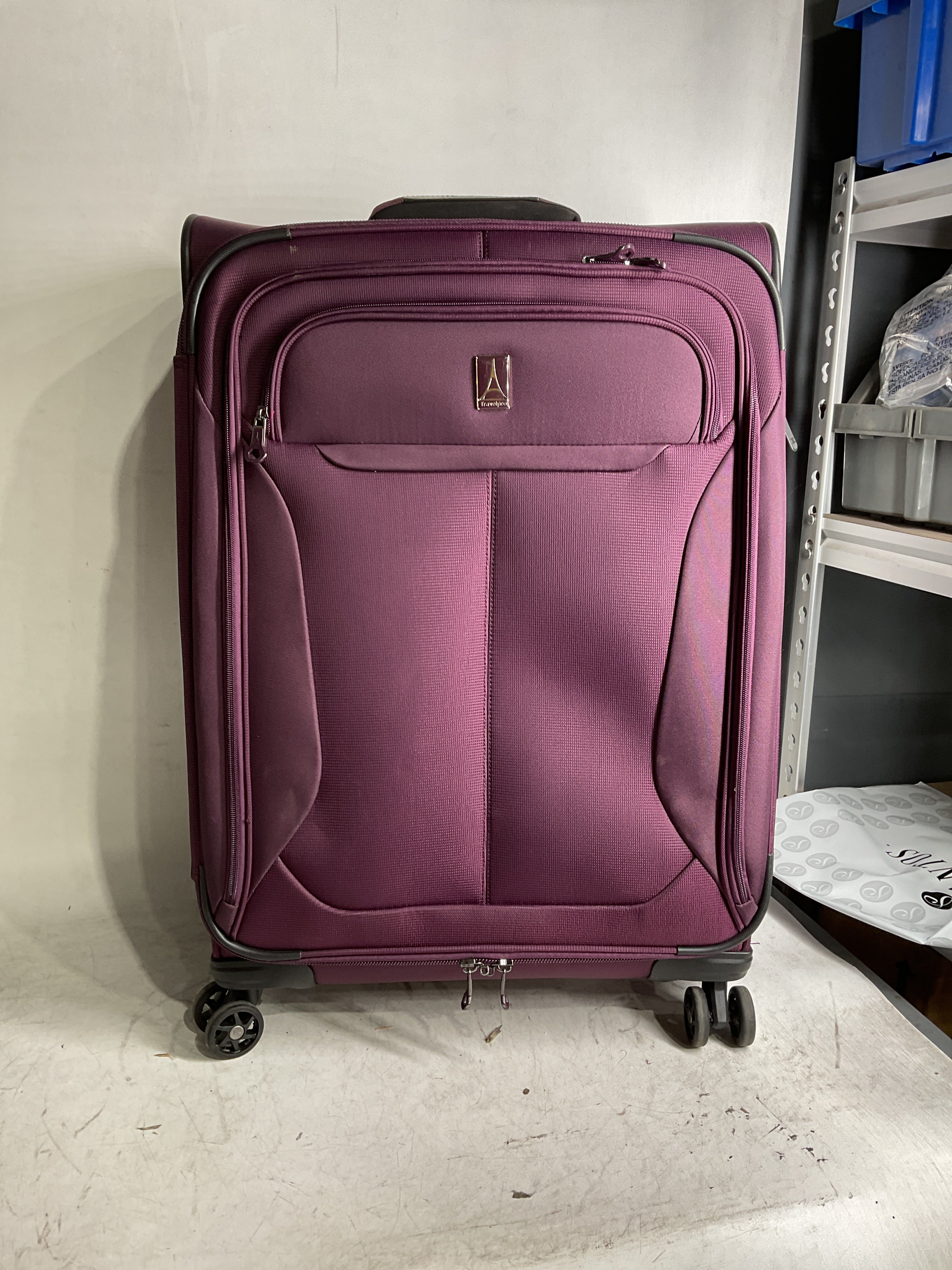 Travelpro Tourlite Softside Expandable Luggage with 4 Spinner Wheels, Lightweight Suitcase, Men and Women ( Deep Purple , Checked-Medium 25-Inch ) Deep Purple Checked Medium 25 Inch U3