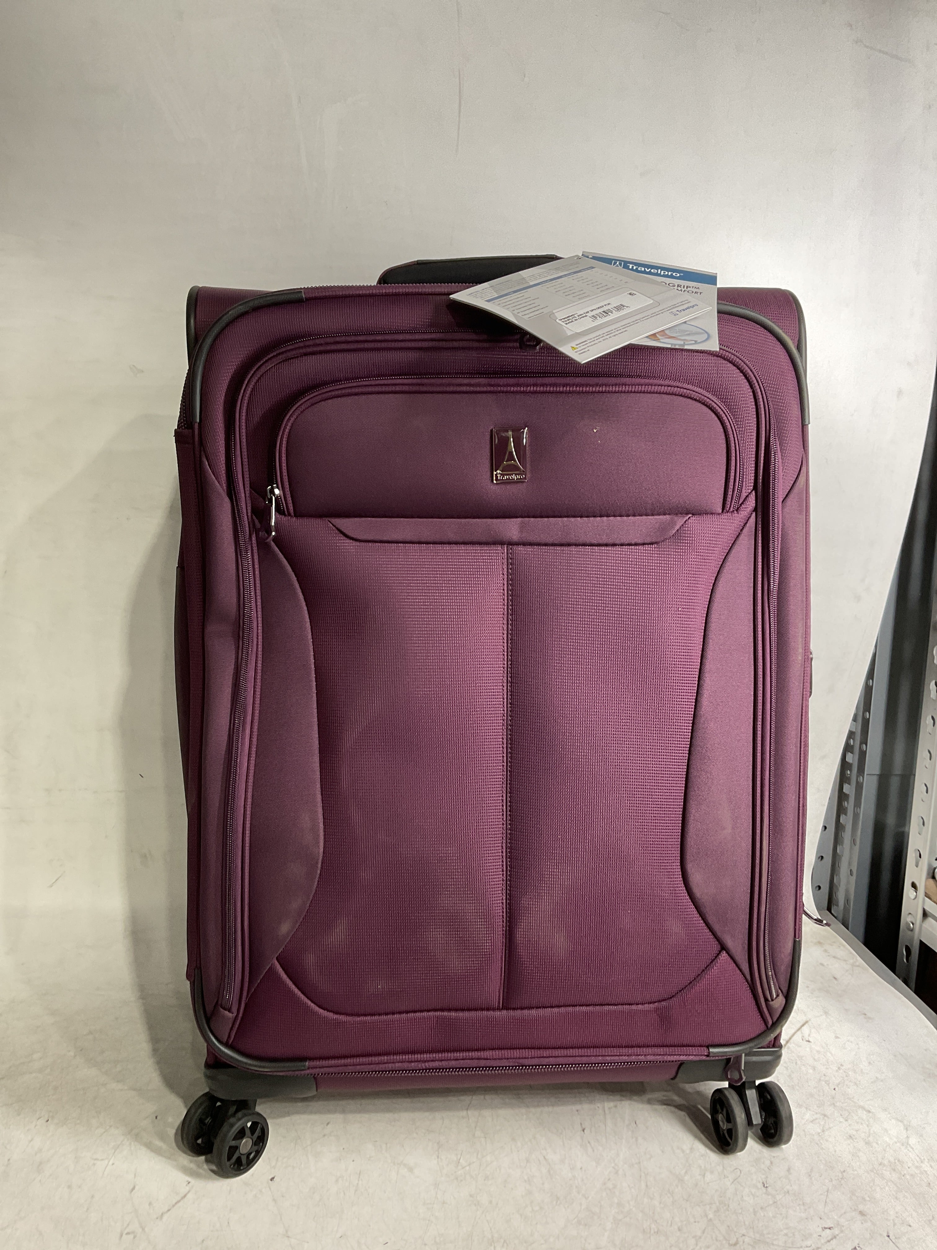Travelpro Tourlite Softside Expandable Luggage with 4 Spinner Wheels, Lightweight Suitcase, Men and Women ( Deep Purple , Checked-Medium 25-Inch ) Deep Purple Checked Medium 25 Inch U4