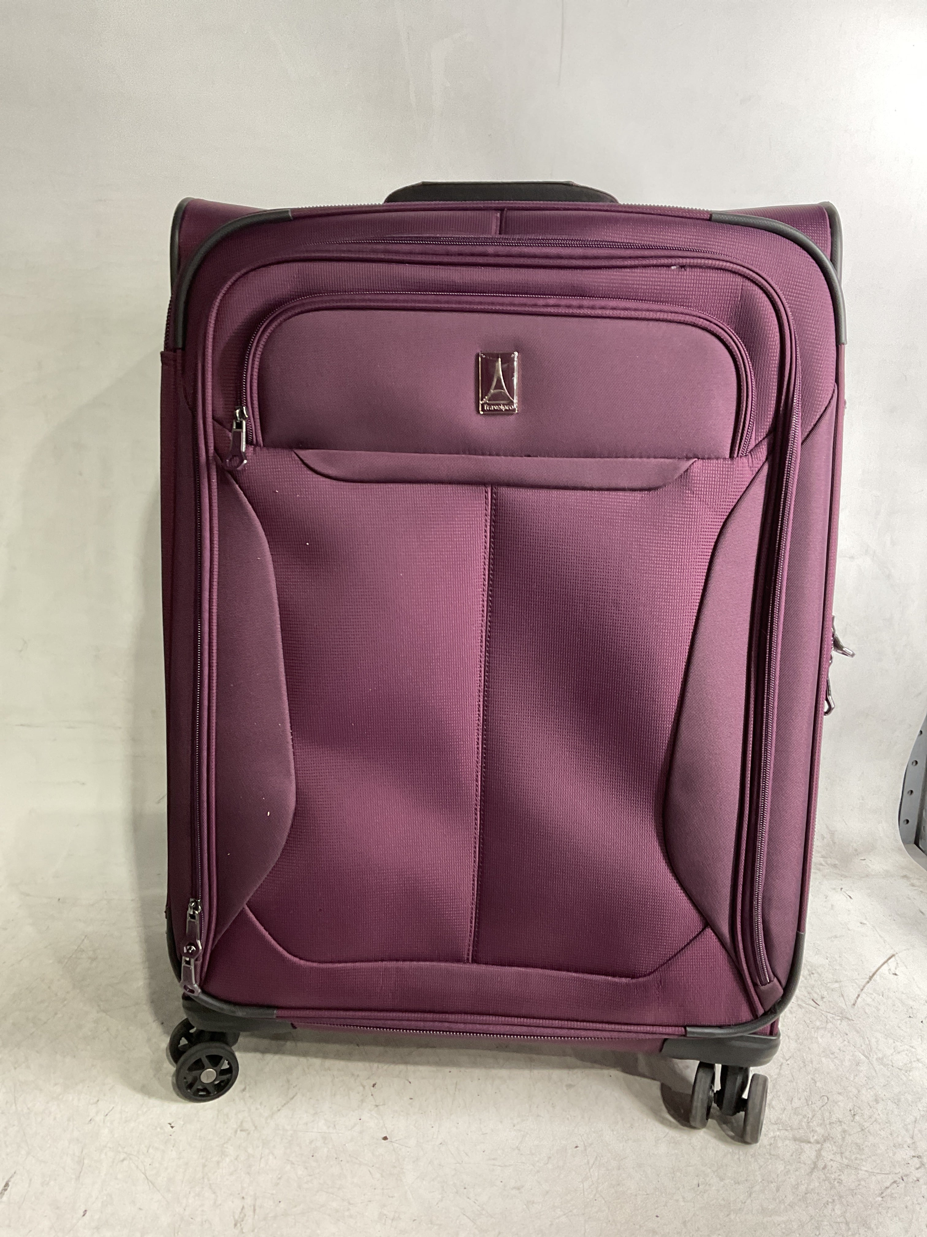 Travelpro Tourlite Softside Expandable Luggage with 4 Spinner Wheels, Lightweight Suitcase, Men and Women ( Deep Purple , Checked-Medium 25-Inch ) Deep Purple Checked Medium 25 Inch U5