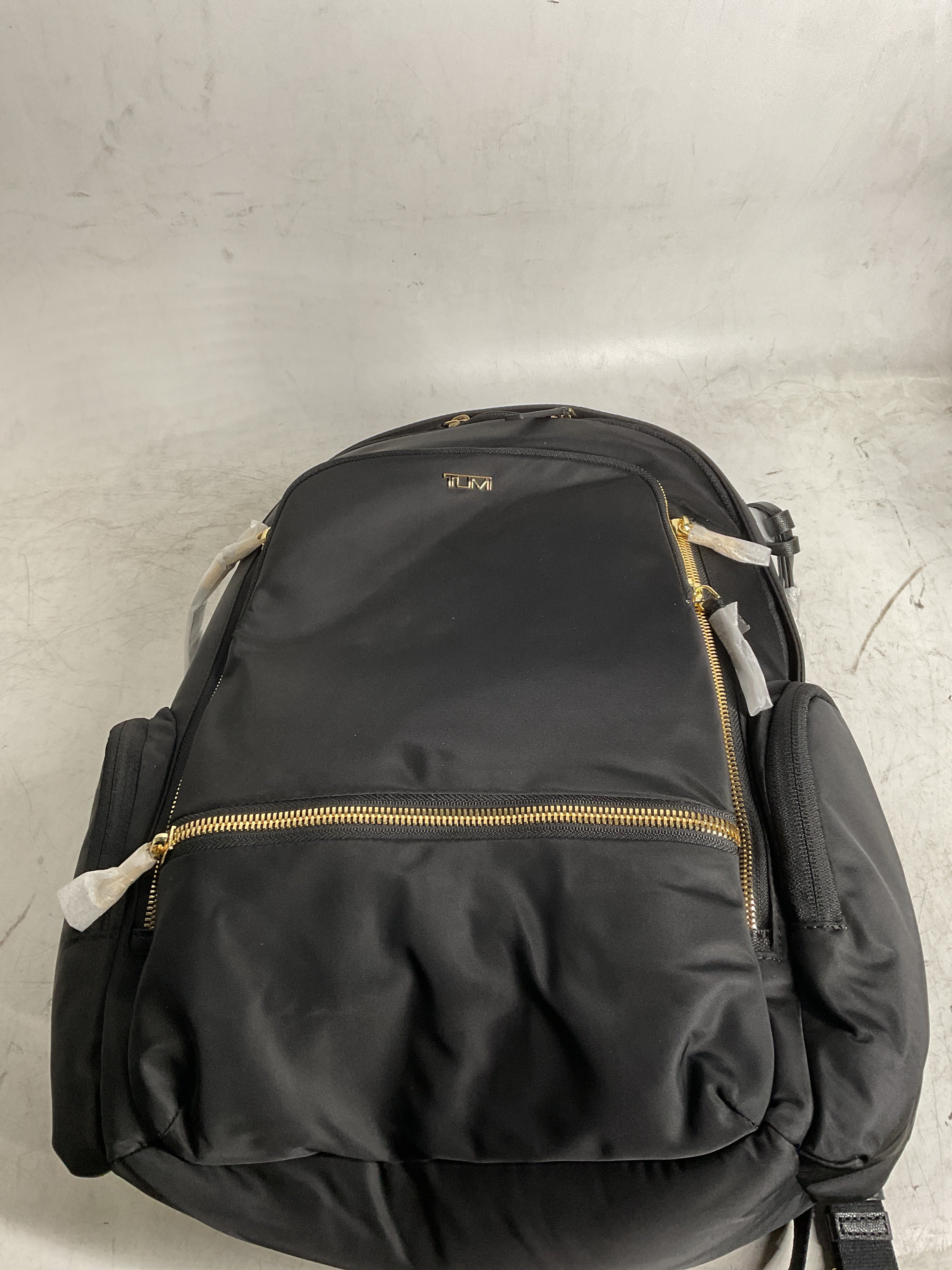 TUMI Celina Backpack ( Black/Gold , One Size ) Black/Gold One Size U1